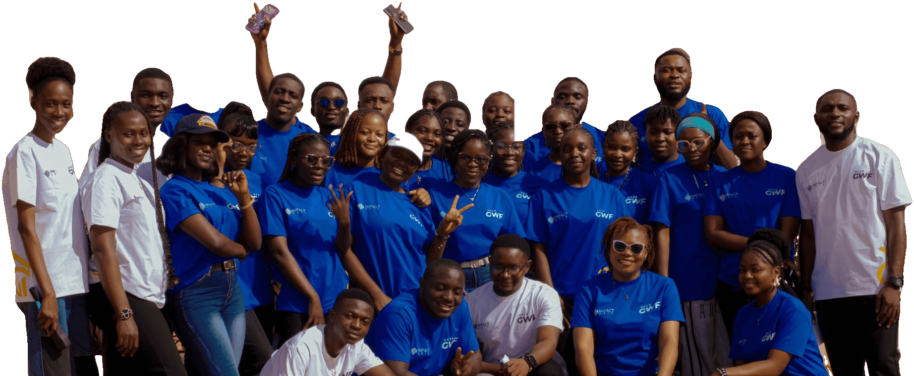 The 2026 Goodwill Fellowship cohort in blue and white Impact Axis T-shirts, smiling together, two of them holding their phones up high